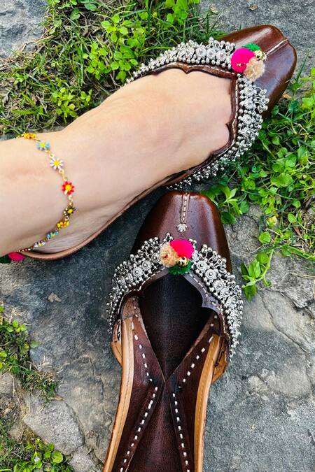 Kasually Klassy Brown Leather Pom-pom Embellished Juttis Online at Aza Fashions Kasually Klassy_Brown Leather Pom-pom Embellished Juttis_Online_at_Aza_Fashions