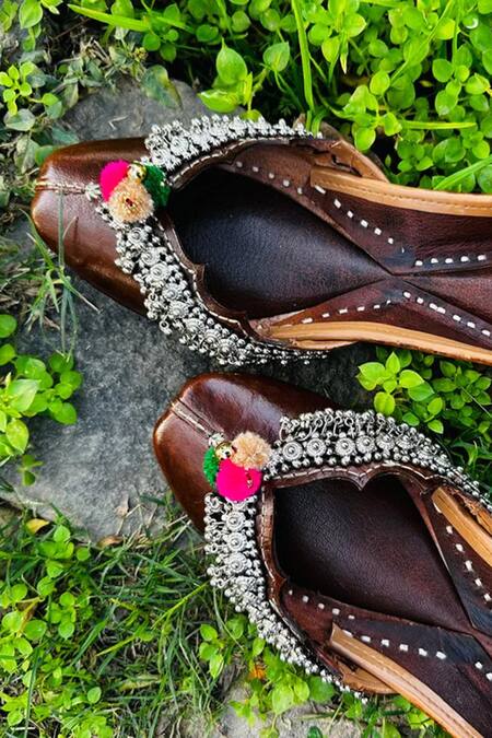 Shop Kasually Klassy Brown Leather Pom-pom Embellished Juttis at Aza Fashions Shop_Kasually Klassy_Brown Leather Pom-pom Embellished Juttis_at_Aza_Fashions