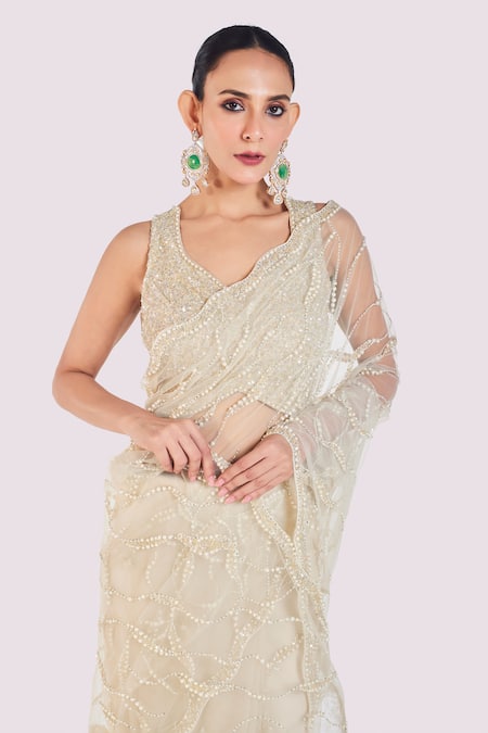 Shop_Onaya_Ivory Net Embroidery, Cut Work V-neck Cutdana Saree Set _Online_at_Aza_Fashions