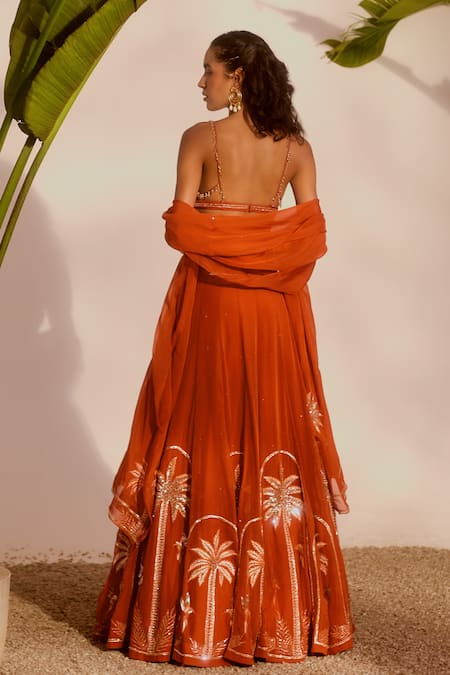 Shop_Silky Bindra_Rust Organza Sequins, Embroidery, Zari Plunge Neck Palm Paradise Lehenga Set _at_Aza_Fashions