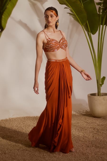 Silky Bindra_Rust Crepe Beads, Sequins Sweetheart Neck Koa Draped Skirt And Blouse Set _Online_at_Aza_Fashions