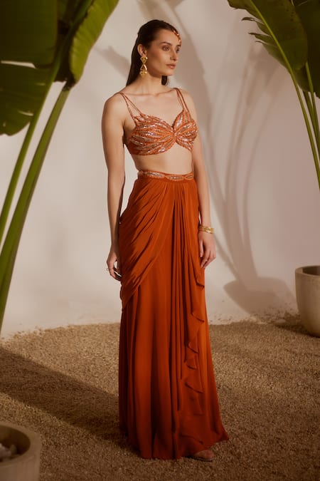 Shop_Silky Bindra_Rust Crepe Beads, Sequins Sweetheart Neck Koa Draped Skirt And Blouse Set _Online_at_Aza_Fashions