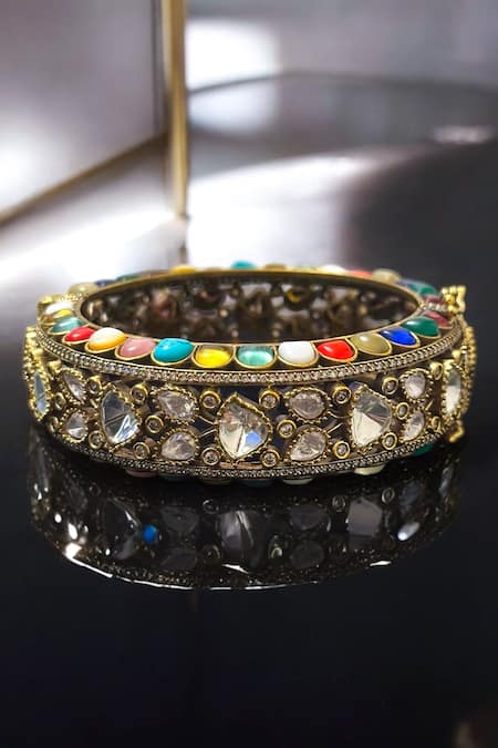 Shop Amaara Jewels Gold Plated Stones Antique Navratan Designer Bracelet at Aza Fashions Shop_Amaara Jewels_Gold Plated Stones Antique Navratan Designer Bracelet _at_Aza_Fashions