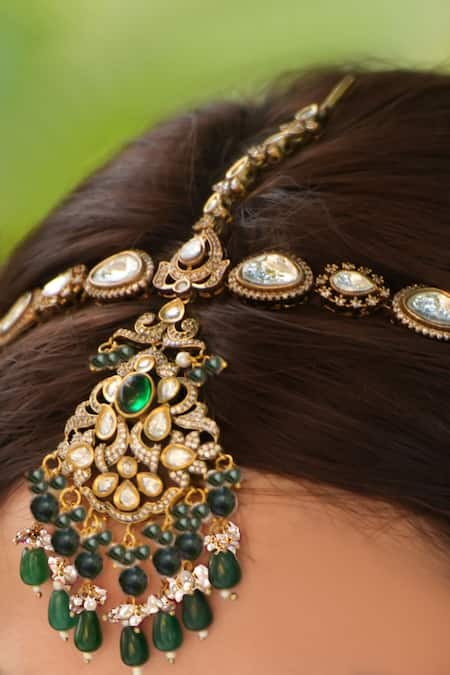 Shop Amaara Jewels Gold Plated Emerald And Matte Maharani Mathapatti at Aza Fashions Shop_Amaara Jewels_Gold Plated Emerald And Matte Maharani Mathapatti _at_Aza_Fashions