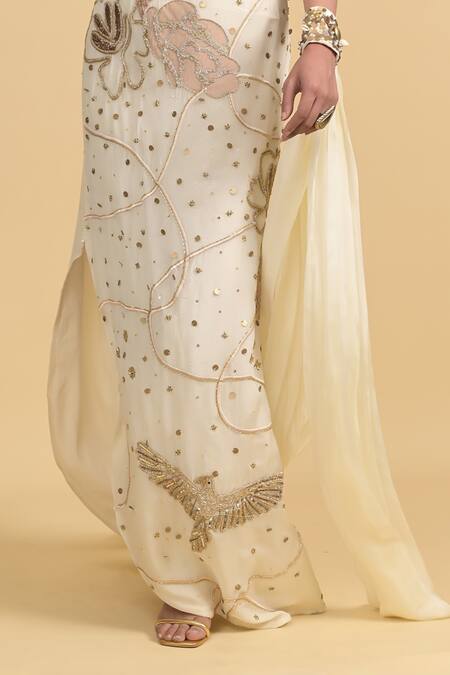 Shop Rishi and Vibhuti Ivory Cotton, Georgette Beads, Sequins, Embellished Bralette Skirt Cape Set Online at Aza Fashions Shop_Rishi and Vibhuti_Ivory Cotton, Georgette Beads, Sequins, Embellished Bralette Skirt Cape Set _Online_at_Aza_Fashions