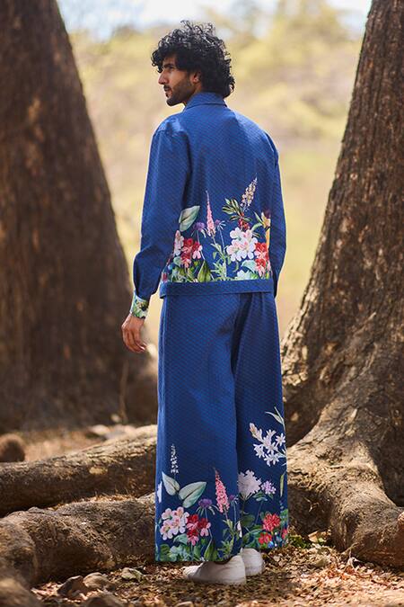 Shop_Nirmooha_Blue Denim The Artisan Flared Pants With Floral Print _at_Aza_Fashions
