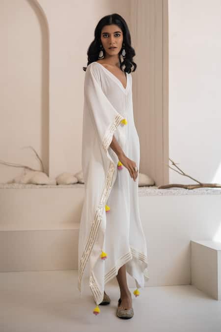 Tuli Ivory Crepe Tassels V-neck Ujjar Kaftan Online at Aza Fashions Tuli_Ivory Crepe Tassels V-neck Ujjar Kaftan _Online_at_Aza_Fashions