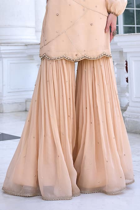 Kalista Beige Tissue, Silk Embroidery Round Neck Zainab Kurta Set With Gharara Online at Aza Fashions Kalista_Beige Tissue, Silk Embroidery Round Neck Zainab Kurta Set With Gharara _Online_at_Aza_Fashions