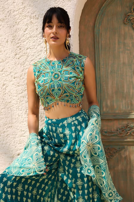 Shop Diyarajvvir Teal Georgette Beads Round Neck Asymmetric Printed Crop Top Pant Set Online at Aza Fashions Shop_Diyarajvvir_Teal Georgette Beads Round Neck Asymmetric Printed Crop Top Pant Set _Online_at_Aza_Fashions