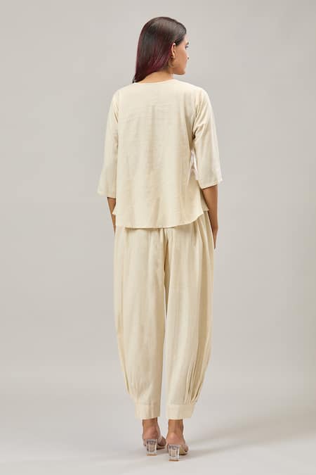 Shop Naintara Bajaj Off White Cotton Embroidery Round Neck Peplum Top And Balloon Pant Set at Aza Fashions Shop_Naintara Bajaj_Off White Cotton Embroidery Round Neck Peplum Top And Balloon Pant Set _at_Aza_Fashions