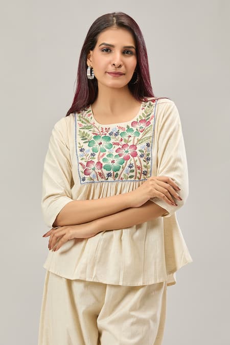 Shop Naintara Bajaj Off White Cotton Embroidery Round Neck Peplum Top And Balloon Pant Set Online at Aza Fashions Shop_Naintara Bajaj_Off White Cotton Embroidery Round Neck Peplum Top And Balloon Pant Set _Online_at_Aza_Fashions