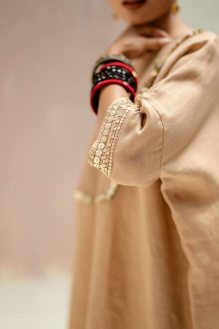 Prahnaaya Beige Linen Round Neck Longline Kaftan Kurta Set at Aza Fashions Prahnaaya_Beige Linen Round Neck Longline Kaftan Kurta Set_at_Aza_Fashions