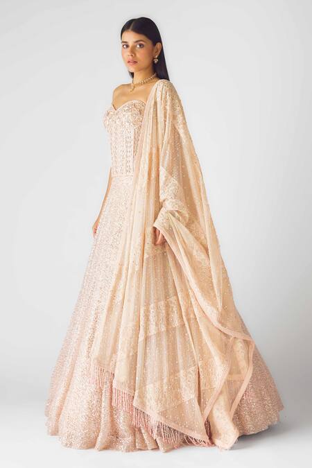 Basanti - Kapde Aur Koffee_Peach Net Sequins, Beads Sweetheart Neck Rose Champagne Corset Lehenga Set_at_Aza_Fashions