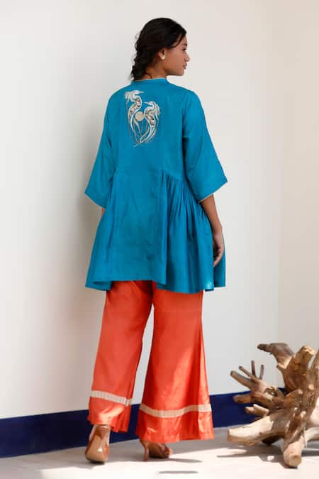 Shop Eeda Blue Silk Embroidery Round Neck Flared Top And Orange Pant Set at Aza Fashions Shop_Eeda_Blue Silk Embroidery Round Neck Flared Top And Orange Pant Set _at_Aza_Fashions