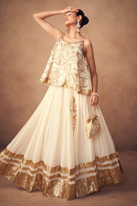 Shop Taavare Off White Muslin, Cotton Tassels, Embroidery Round Designer Fusion Lehenga Set Online at Aza Fashions Shop_Taavare_Off White Muslin, Cotton Tassels, Embroidery Round Designer Fusion Lehenga Set_Online_at_Aza_Fashions