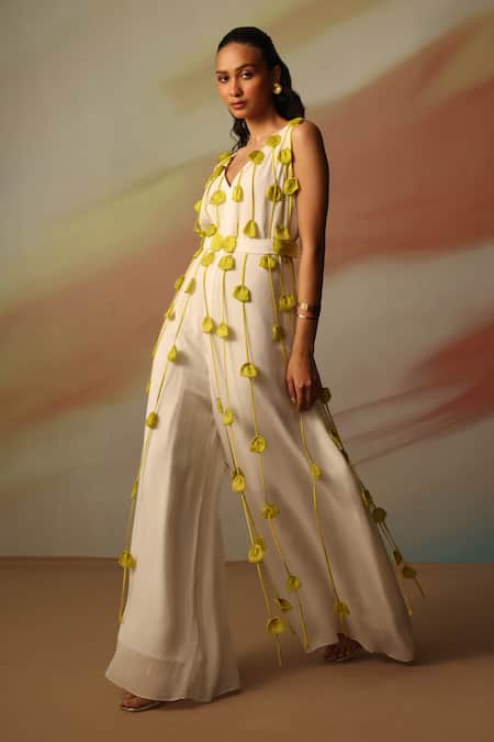 Vanshika Agarwal Label_White Georgette, Taffeta Fabric Flowers V-neck Pixie Jumpsuit _Online_at_Aza_Fashions