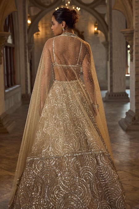 Shop_Seema Gujral_Gold Net Sequins, Beads V-neck Lehenga Set _at_Aza_Fashions