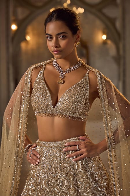 Seema Gujral_Gold Net Sequins, Beads V-neck Lehenga Set _Online_at_Aza_Fashions
