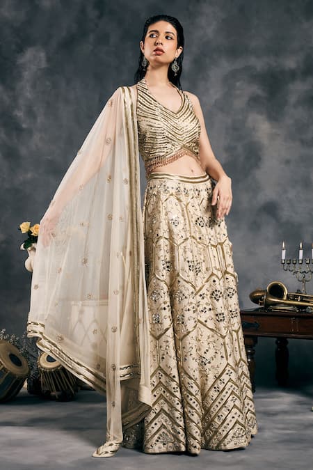 Vandana Sethi_Ivory Silk Embroidery Halter Neck And Gold Fusion Lehenga Set _at_Aza_Fashions