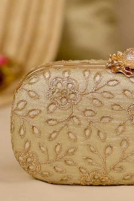 Buy_Amyra_Gold Cut Work Tarang Capsule Clutch _Online_at_Aza_Fashions