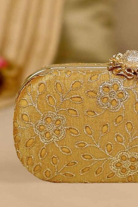 Amyra Mustard Cut Work Tarang Capsule Clutch at Aza Fashions Amyra_Mustard Cut Work Tarang Capsule Clutch _at_Aza_Fashions