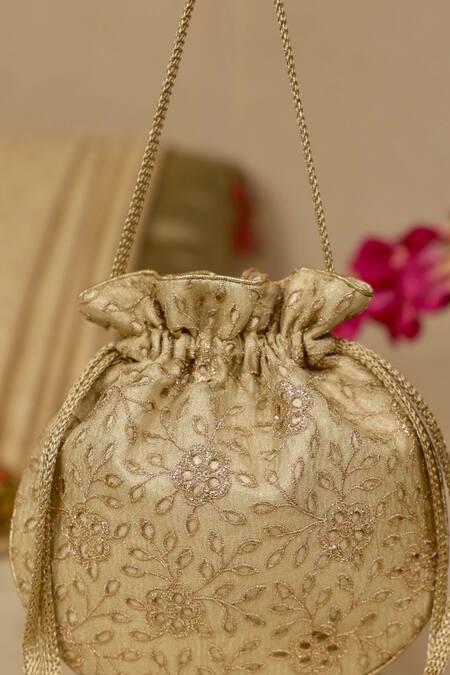 Shop_Amyra_Gold Embroidery, Tassels Tarang Cutwork Potli Bag_Online_at_Aza_Fashions
