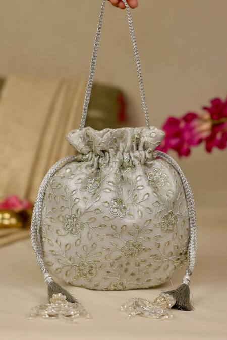 Amyra_Silver Embroidery, Tassels Tarang Cutwork Potli Bag_Online_at_Aza_Fashions