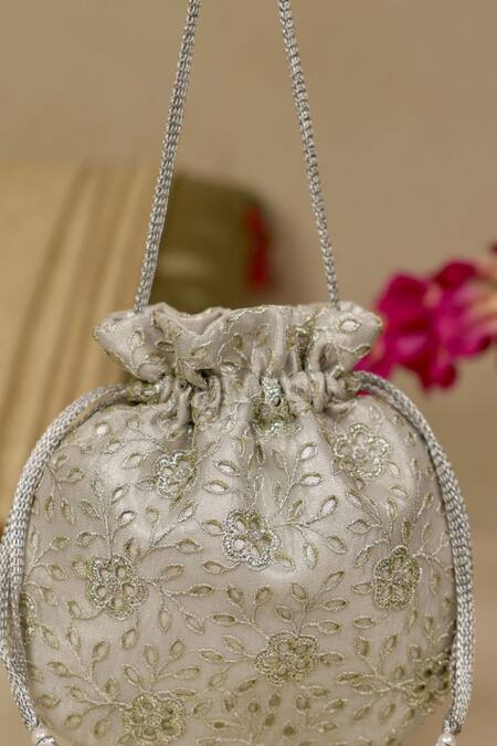 Shop_Amyra_Silver Embroidery, Tassels Tarang Cutwork Potli Bag_Online_at_Aza_Fashions