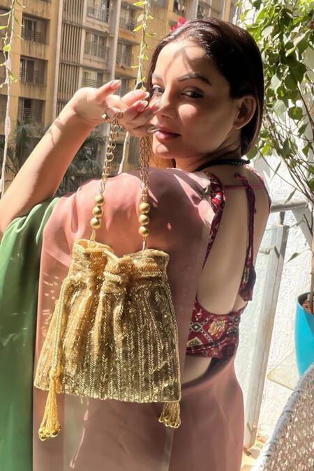 Shop_A Clutch Story_Gold Sequins Embroidered Potli _Online_at_Aza_Fashions