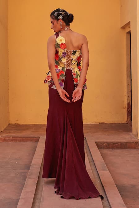 Shop Label Moni K Wine Satin Applique One Shoulder Floral Embroidered Corset And Draped Skirt Set at Aza Fashions Shop_Label Moni K_Wine Satin Applique One Shoulder Floral Embroidered Corset And Draped Skirt Set _at_Aza_Fashions