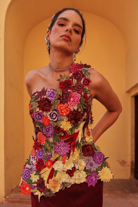 Shop Label Moni K Wine Satin Applique One Shoulder Floral Embroidered Corset And Draped Skirt Set Online at Aza Fashions Shop_Label Moni K_Wine Satin Applique One Shoulder Floral Embroidered Corset And Draped Skirt Set _Online_at_Aza_Fashions