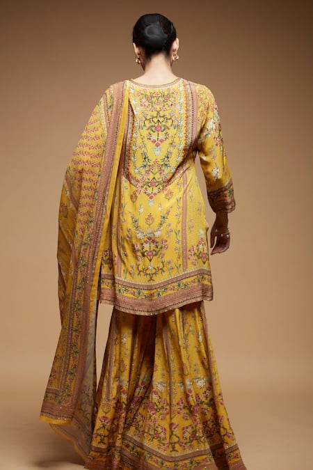 Shop Nirraamyaa Mustard Brocade, Georgette Rhinestones Split V-neck Yellow Kurta Sharara Set at Aza Fashions Shop_Nirraamyaa_Mustard Brocade, Georgette Rhinestones Split V-neck Yellow Kurta Sharara Set _at_Aza_Fashions