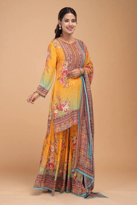 Shop_Nirraamyaa_Mustard Brocade, Georgette Rhinestones Round Neck Designer Yellow Kurta Set_Online_at_Aza_Fashions