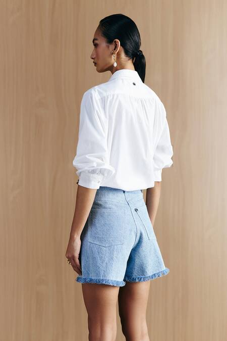 Shop Mellowdrama Blue Cotton Studs Washed Denim Studded Shorts at Aza Fashions Shop_Mellowdrama_Blue Cotton Studs Washed Denim Studded Shorts_at_Aza_Fashions
