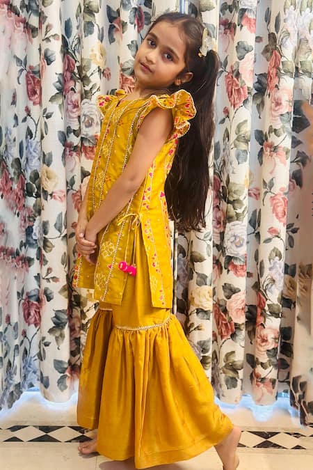 Shop Rage Attire-Sweta Saria Yellow Chanderi, Silk Pom-poms, Embroidery Patola Panelled Kurta Sharara Set at Aza Fashions Shop_Rage Attire-Sweta Saria_Yellow Chanderi, Silk Pom-poms, Embroidery Patola Panelled Kurta Sharara Set _at_Aza_Fashions