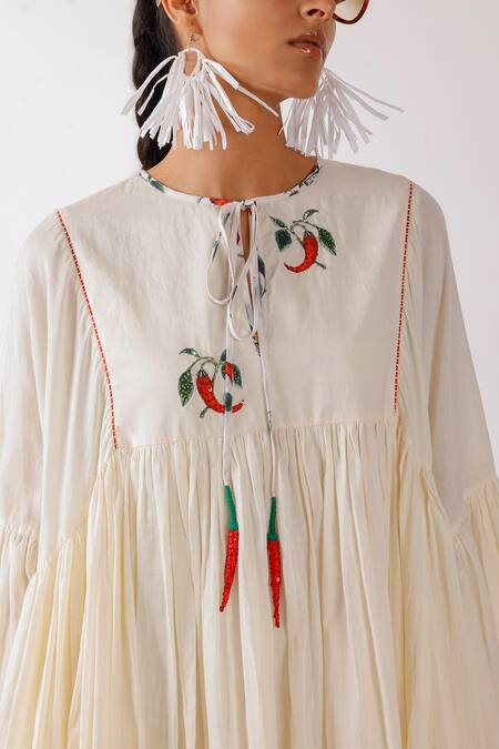 Shop Nikasha Cream Cotton Embroidery Round Neck Asymmetric Chilly Dress Online at Aza Fashions Shop_Nikasha_Cream Cotton Embroidery Round Neck Asymmetric Chilly Dress _Online_at_Aza_Fashions