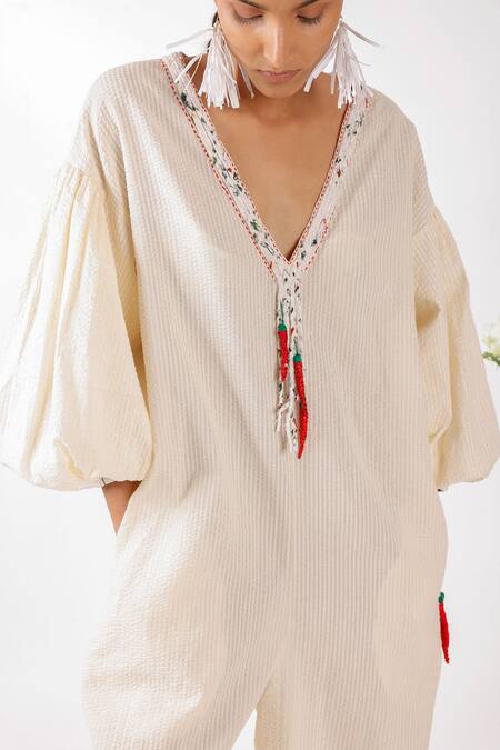 Nikasha Cream Cotton Tassels, Embroidery V-neck Chilly Seersucker Jumpsuit Online at Aza Fashions Nikasha_Cream Cotton Tassels, Embroidery V-neck Chilly Seersucker Jumpsuit _Online_at_Aza_Fashions