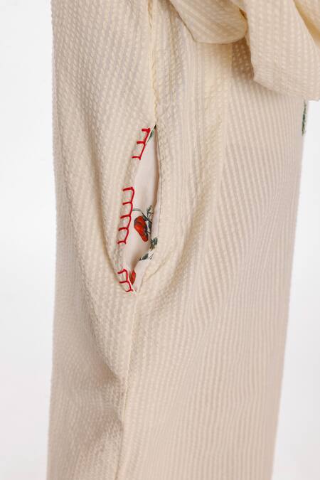 Shop Nikasha Cream Cotton Tassels, Embroidery V-neck Chilly Seersucker Jumpsuit Online at Aza Fashions Shop_Nikasha_Cream Cotton Tassels, Embroidery V-neck Chilly Seersucker Jumpsuit _Online_at_Aza_Fashions