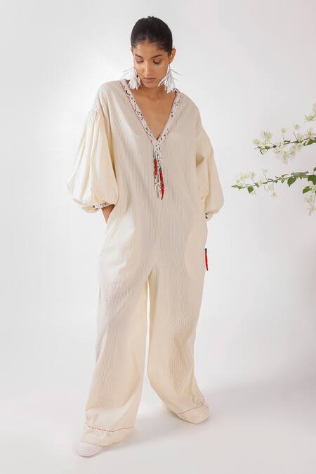 Buy Nikasha Cream Cotton Tassels, Embroidery V-neck Chilly Seersucker Jumpsuit Buy_Nikasha_Cream Cotton Tassels, Embroidery V-neck Chilly Seersucker Jumpsuit