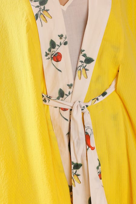 Nikasha Yellow Cotton Shawl Neck Chilly Print Shrug at Aza Fashions Nikasha_Yellow Cotton Shawl Neck Chilly Print Shrug _at_Aza_Fashions