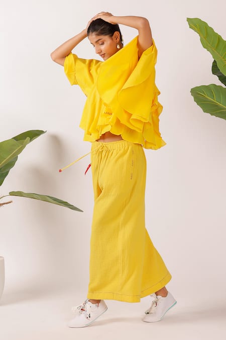 Nikasha Yellow Cotton Embroidery V-neck Ruffle Top Online at Aza Fashions Nikasha_Yellow Cotton Embroidery V-neck Ruffle Top _Online_at_Aza_Fashions