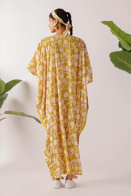 Shop Nikasha Yellow Cotton Embroidery V-neck Pomegranate Print Ruched Kaftan at Aza Fashions Shop_Nikasha_Yellow Cotton Embroidery V-neck Pomegranate Print Ruched Kaftan _at_Aza_Fashions