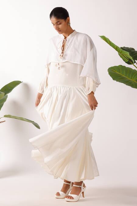 Nikasha_Cream Cotton Fabric Flowers Round Neck Jamdani Godet Cape Dress_Online_at_Aza_Fashions