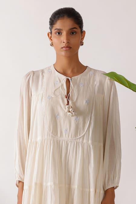 Buy Nikasha Cream Cotton Fabric Flowers Round Neck Jamdani Embroidered Yoke Tier Dress Online at Aza Fashions Buy_Nikasha_Cream Cotton Fabric Flowers Round Neck Jamdani Embroidered Yoke Tier Dress_Online_at_Aza_Fashions