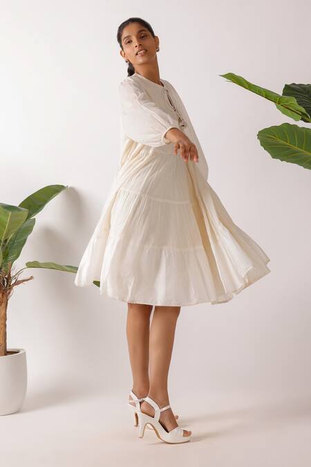 Shop Nikasha Cream Cotton Fabric Flowers Round Neck Jamdani Embroidered Yoke Tier Dress Online at Aza Fashions Shop_Nikasha_Cream Cotton Fabric Flowers Round Neck Jamdani Embroidered Yoke Tier Dress_Online_at_Aza_Fashions