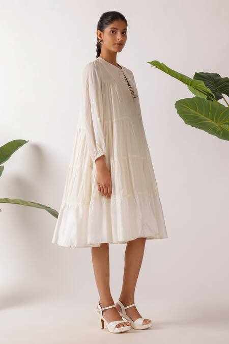 Nikasha Cream Cotton Fabric Flowers Round Neck Jamdani Embroidered Yoke Tier Dress at Aza Fashions Nikasha_Cream Cotton Fabric Flowers Round Neck Jamdani Embroidered Yoke Tier Dress_at_Aza_Fashions