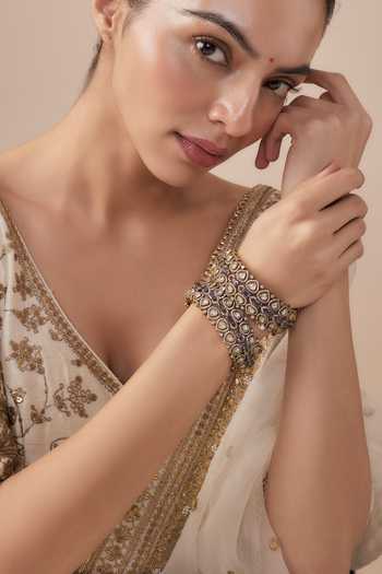 Buy Vivinia By Vidhi Mehra Gold Plated Imitation Diamonds And Purple Kundan Polki Bangles at Aza Fashions Buy_Vivinia By Vidhi Mehra_Gold Plated Imitation Diamonds And Purple Kundan Polki Bangles _at_Aza_Fashions