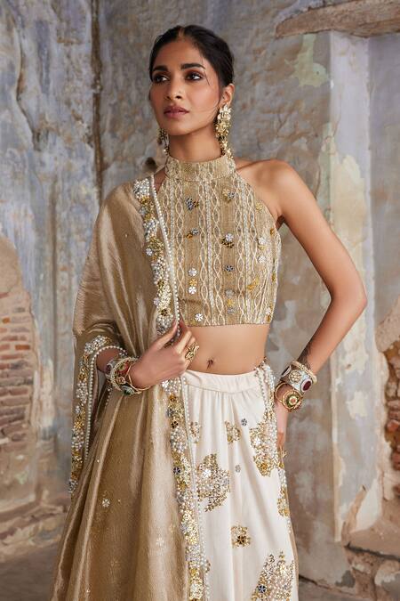 Shop Etasha By Asha Jain Ivory Silk, Tissue Sequins, Embroidery Halter Neck And Gold Lehenga Set Online at Aza Fashions Shop_Etasha By Asha Jain_Ivory Silk, Tissue Sequins, Embroidery Halter Neck And Gold Lehenga Set _Online_at_Aza_Fashions