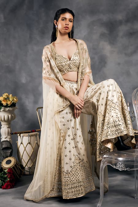 Vandana Sethi_Ivory Silk Beads, Sequins Sweetheart Neck Shimmer Raw Sharara Set _at_Aza_Fashions