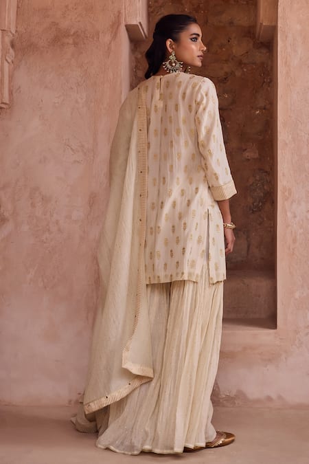 Kritika Dawar Ivory Silk, Chanderi Embroidery, Metallic Thread Round Neck Zari Gharara Set Online at Aza Fashions Kritika Dawar_Ivory Silk, Chanderi Embroidery, Metallic Thread Round Neck Zari Gharara Set _Online_at_Aza_Fashions